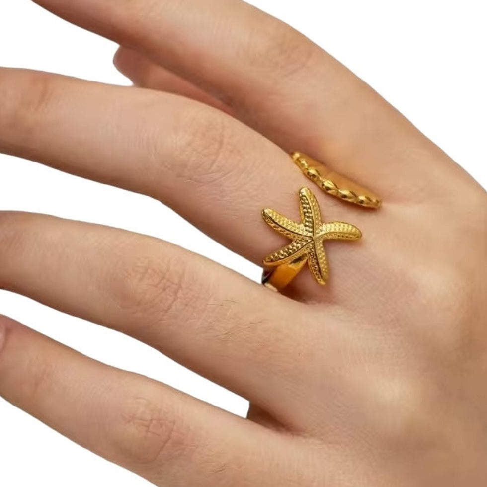 Shelly | Justerbar ring guld sjöstjärna & snäcka