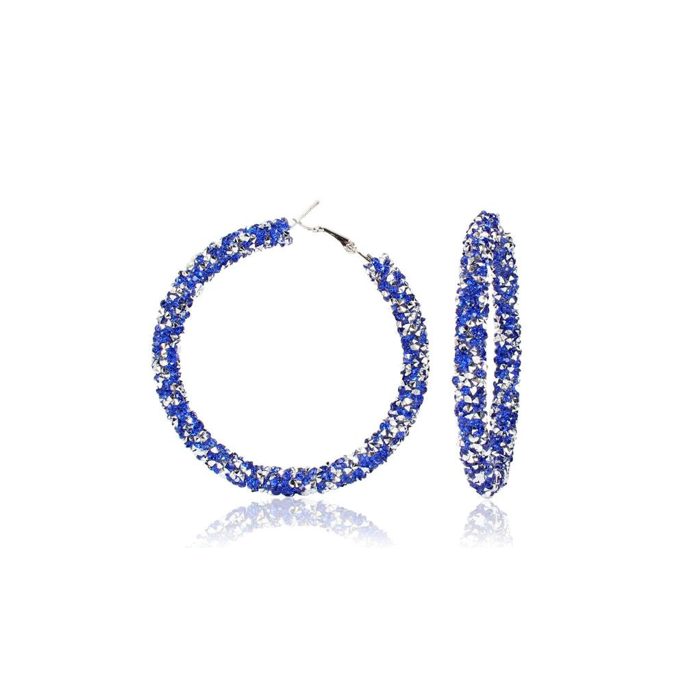 BESKRIVNING När och vart är partyt? Kalla in alla Bachelorettes med Öronringar för extravagans och fest. MÅTT  6,5 cm ø  MATERIAL Silver på zink med glitter av strass (nickelfri)     För maximal hållbarhet, se vår guide BLING OF BENELUX® - SIMPLY HER STYLE